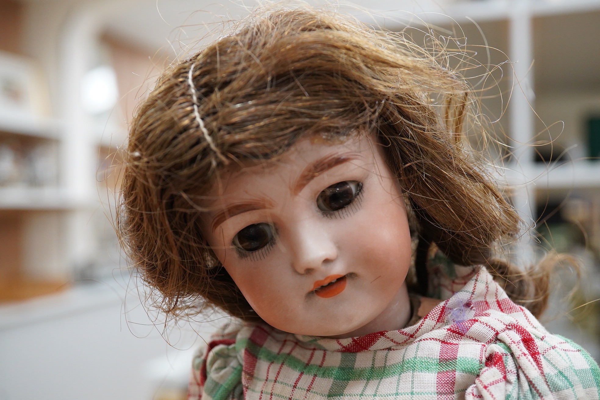 A Simon & Halbig doll, pierced ears, original wig. body lining good condition, height 38cm.